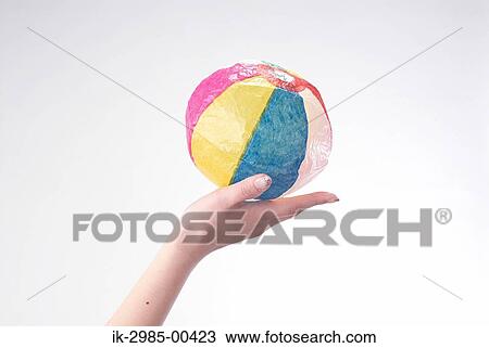 Stock Image - Hand Holding Paper Balls. Fotosearch
