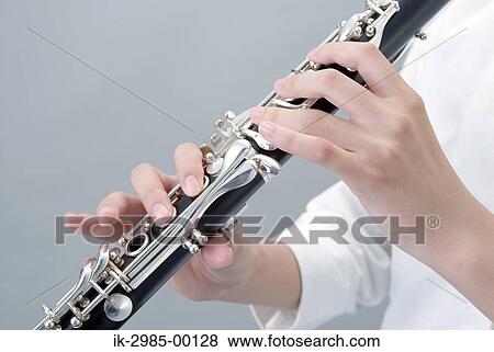 Stock Photo - Hands Holding Clarinet. Fotosearch
