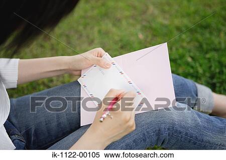 Stock Photography - Hands of a woman writing letter. Fotosearch
