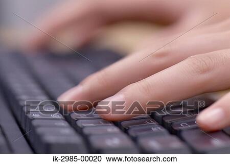 Stock Image - Hands Typing on a Black Keyboard. Fotosearch