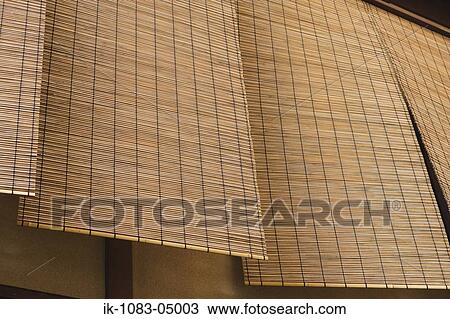 Stock Image - Hanging bamboo window blinds. Fotosearch