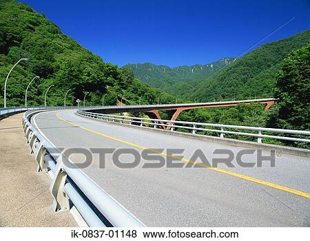 Highway passing through forest View Large Photo Image Stock Photo - Highway passing through forest. Fotosearch
