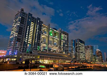 Stock Image - Illuminated skyscrapers at evening. Fotosearch