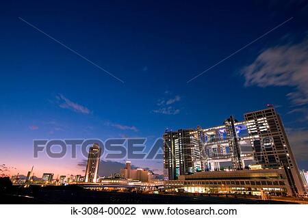 Illuminated skyscrapers at evening View Large Photo Image Stock Image - Illuminated skyscrapers at evening. Fotosearch