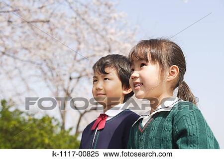 Stock Photography - Japanese boy and girl enjoying together. Fotosearch