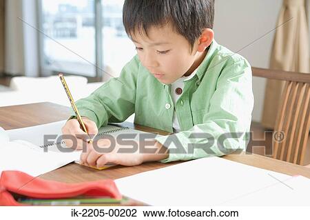 Japanese boy doing his homework View Large Photo Image Stock Image - Japanese boy doing his homework. Fotosearch