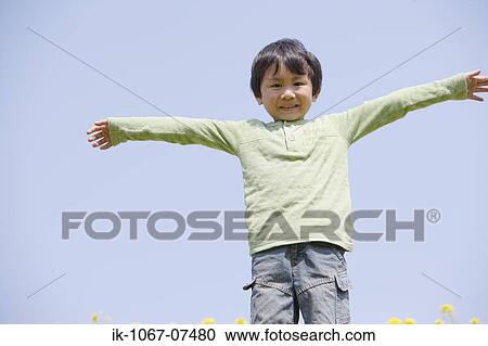 Japanese boy with arms outstretched View Large Photo Image Stock Image - Japanese boy with arms outstretched. Fotosearch