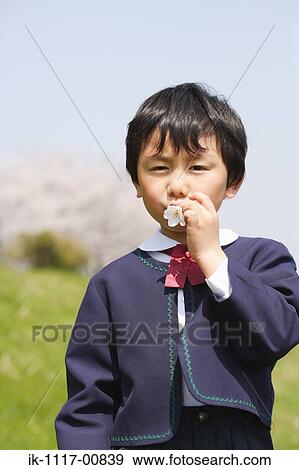 Japanese boy with flower in his mouth View Large Photo Image Stock Photo - Japanese boy with flower in his mouth. Fotosearch