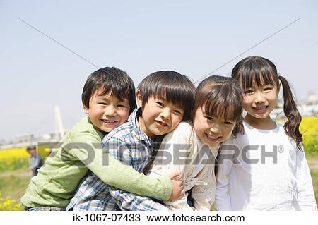 Japanese children smiling and playing together View Large Photo Image Stock Image - Japanese children smiling and playing together. Fotosearch