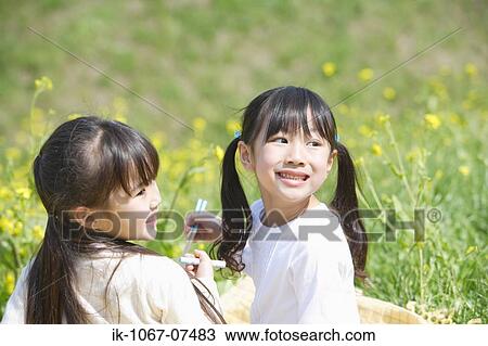 Japanese girls eating lunch together View Large Photo Image Stock Image - Japanese girls eating lunch together. Fotosearch