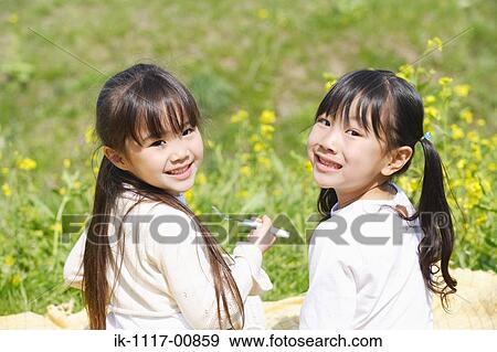 Stock Photo - Japanese girls eating lunch together. Fotosearch
