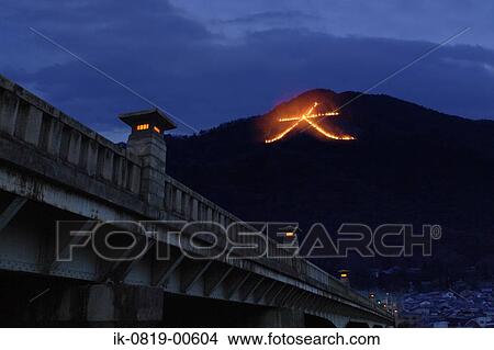 Japanese sign on hilltop with illuminated lights on bridge View Large Photo Image Picture - Japanese sign on hilltop with illuminated lights on bridge. Fotosearch