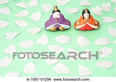 Japanese Traditional Figurines with Sakura petals View Large Photo Image Picture - Japanese Traditional Figurines with Sakura petals. Fotosearch