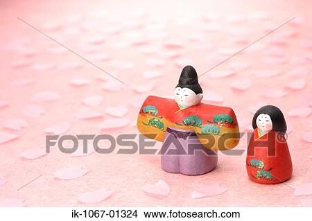 Picture - Japanese Traditional Figurines with Sakura petals. Fotosearch
