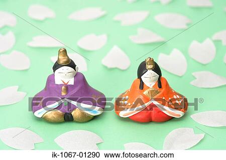 Japanese Traditional Figurines with Sakura petals View Large Photo Image Stock Image - Japanese Traditional Figurines with Sakura petals. Fotosearch