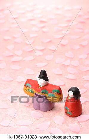 Stock Photo - Japanese Traditional Figurines with Sakura petals. Fotosearch