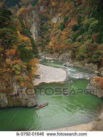 Stock Photograph - Lake Passing Through Mountains at Tochigi Prefecture. Fotosearch