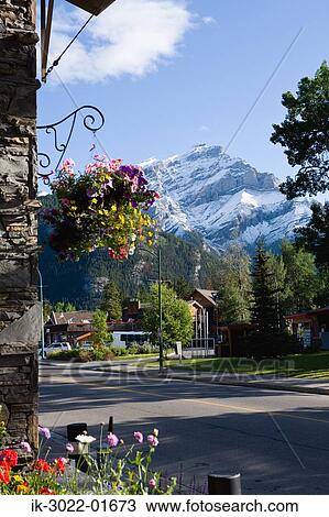 Lake with Snow-Capped Mountains in Banff, Canada View Large Photo Image Stock Image - Lake with Snow-Capped Mountains in Banff, Canada. Fotosearch