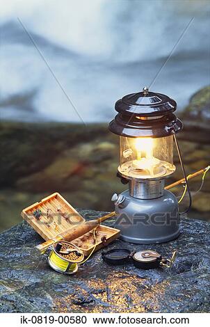 Lantern with Fishing Rod Lying on Stone View Large Photo Image Stock Image - Lantern with Fishing Rod Lying on Stone. Fotosearch