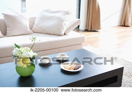 Living room with table and couch View Large Photo Image Stock Image - Living room with table and couch. Fotosearch