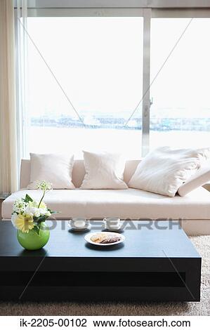 Living room with table and couch View Large Photo Image Stock Image - Living room with table and couch. Fotosearch