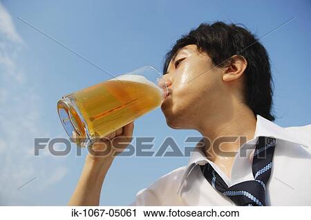 Stock Image - Man Drinking Beer. Fotosearch