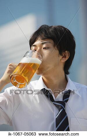 Stock Image - Man Drinking Beer. Fotosearch