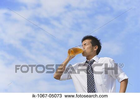 Stock Image - Man Drinking Beer. Fotosearch
