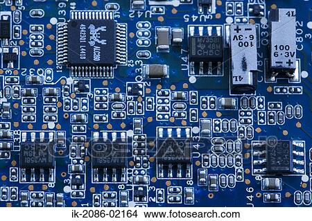Picture - Microchips on motherboard. Fotosearch