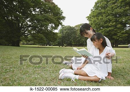 Mother and Daughter Reading a Book View Large Photo Image Stock Photography - Mother and Daughter Reading a Book. Fotosearch