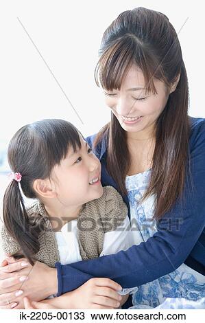 Mother hugging her daughter View Large Photo Image Stock Image - Mother hugging her daughter. Fotosearch
