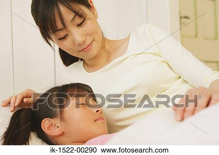 Mother with Sleeping Daughter View Large Photo Image Stock Image - Mother with Sleeping Daughter. Fotosearch