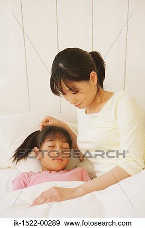 Mother with Sleeping Daughter View Large Photo Image Stock Photo - Mother with Sleeping Daughter. Fotosearch