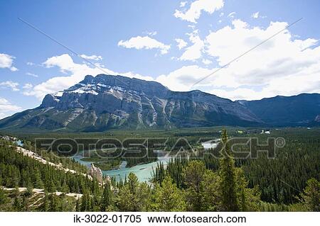Mountain Range against Cloudy Sky in Alberta, Canada View Large Photo Image Stock Photography - Mountain Range against Cloudy Sky in Alberta, Canada. Fotosearch