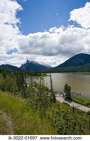Mountain Range with Lake against Cloudy Sky View Large Photo Image Stock Photo - Mountain Range with Lake against Cloudy Sky. Fotosearch