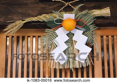 New Year's good luck "Shimenawa" above entry door View Large Photo Image Stock Photograph - New Year's good luck "Shimenawa" above entry door. Fotosearch