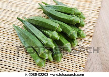 Stock Image - Okra in straw mat. Fotosearch