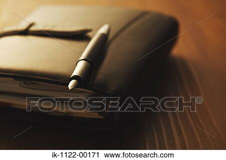 Open leather diary with fountain pen View Large Photo Image Stock Image - Open leather diary with fountain pen. Fotosearch