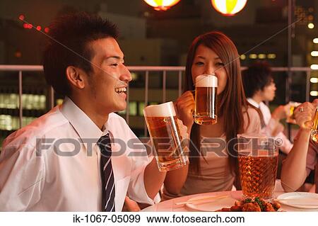 People Enjoying Beer and Snacks View Large Photo Image Stock Photo - People Enjoying Beer and Snacks. Fotosearch