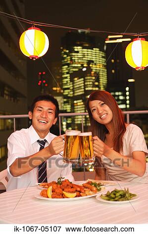 People Enjoying Beer and Snacks View Large Photo Image Stock Photo - People Enjoying Beer and Snacks. Fotosearch