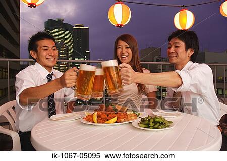 Stock Photography - People Enjoying Beer and Snacks. Fotosearch