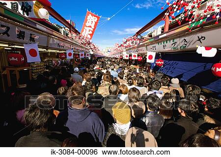 People outside shops in congested marketplace View Large Photo Image Stock Photograph - People outside shops in congested marketplace. Fotosearch