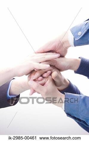 Stock Image - People Putting Fists Togeher. Fotosearch