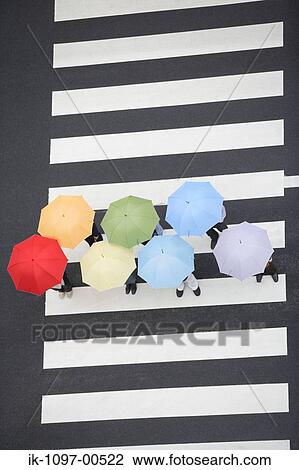 People Walking with Umbrellas View Large Photo Image Stock Image - People Walking with Umbrellas. Fotosearch