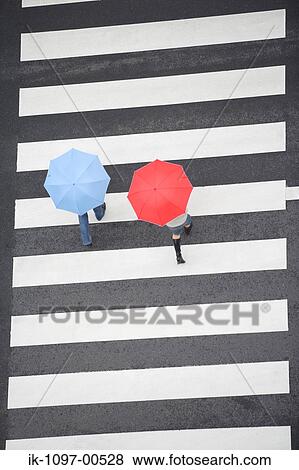 People Walking with Umbrellas View Large Photo Image Stock Photo - People Walking with Umbrellas. Fotosearch