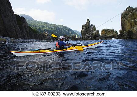 Stock Image - Person Boating on Kayak, Hokkaido, Japan . Fotosearch