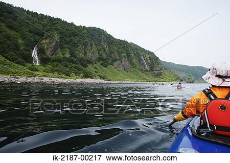 Person Boating on Kayak, Hokkaido, Japan View Large Photo Image Stock Photo - Person Boating on Kayak, Hokkaido, Japan . Fotosearch
