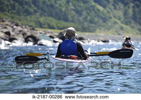 Stock Photograph - Person Boating on Kayak, Hokkaido, Japan . Fotosearch