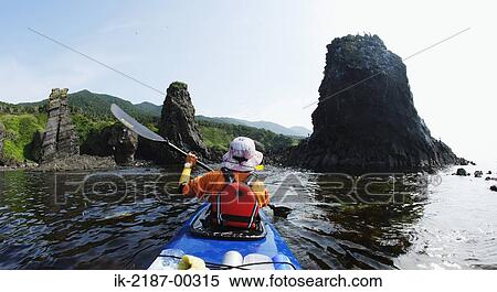 Stock Photography - Person Boating on Kayak, Hokkaido, Japan . Fotosearch