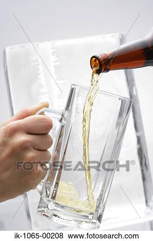 Stock Photo - Pouring a Beer. Fotosearch